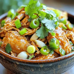 - 4 chicken thighs (skinless and bone-in) - 1 tablespoon olive oil - 1 medium onion, finely chopped - 4 cloves garlic, minced - 2-3 scallions, thinly sliced - 1-2 habanero peppers (adjust according to your spice preference), finely chopped - 1 teaspoon fresh ginger, grated - 2 teaspoons dried thyme - 2 teaspoons allspice - 1 tablespoon brown sugar - 1 tablespoon soy sauce - 2 tablespoons fresh lime juice - Salt and black pepper to taste - Fresh cilantro, chopped (for garnish) Gathering the right ingredients is key to making great slow cooker jerk chicken. You'll need chicken thighs for their rich flavor and juicy texture. The skinless, bone-in variety works best here. Next, you’ll mix the marinade. This includes garlic, scallions, habanero peppers, ginger, thyme, allspice, brown sugar, soy sauce, and lime juice. Each part plays a role in building the dish's bold flavors. For the finishing touch, don’t forget salt and black pepper. These enhance the taste and balance out the spices. Finally, fresh cilantro adds a pop of color and freshness when you serve your dish. With these ingredients, you are ready to create a mouthwatering meal that is easy and packed with flavor. Start by mixing the marinade. In a medium bowl, combine these ingredients: - 4 cloves garlic, minced - 2-3 scallions, thinly sliced - 1-2 habanero peppers, finely chopped - 1 teaspoon fresh ginger, grated - 2 teaspoons dried thyme - 2 teaspoons allspice - 1 tablespoon brown sugar - 1 tablespoon soy sauce - 2 tablespoons fresh lime juice Whisk everything together until smooth. This marinade packs in rich flavors. Next, take the chicken thighs. Generously rub the marinade all over each piece. Make sure the chicken is fully coated. For best results, cover the chicken and refrigerate for at least 30 minutes. If you have time, marinate overnight for deeper flavor. If you want, sear the chicken for added taste. Heat 1 tablespoon olive oil in a skillet over medium heat. Once hot, add the marinated chicken thighs. Sear them for 3-4 minutes on each side. You want a golden-brown crust. But if you’re short on time, skip this step. Now, place the seared chicken thighs in the slow cooker. Layer them evenly. Pour any leftover marinade from the skillet over the chicken. This ensures no flavor goes to waste. Add chopped onions around the chicken. Season with salt and black pepper to taste. Cover the slow cooker with its lid. Cook on high for 3-4 hours or on low for 6-8 hours. The chicken should be tender and fully cooked. Once cooked, shred the chicken right in the slow cooker using two forks. This lets the chicken soak up all the delicious juices. Gently stir everything together. Serve hot, garnished with chopped cilantro for a fresh touch. Enjoy your flavorful jerk chicken over rice or with grilled veggies! Marinating is key to great jerk chicken. Start with a rich marinade. Use garlic, scallions, ginger, thyme, and allspice. Combine these in a bowl. Mix well until smooth and fragrant. Coat the chicken thighs thoroughly. Make sure every piece is covered. For the best taste, let it sit in the fridge. Aim for at least 30 minutes. If you can, let it marinate overnight. This allows the flavors to soak in deeply. Searing the chicken adds a nice crust and flavor. Heat olive oil in a skillet over medium heat. Once hot, place the marinated chicken in. Cook for 3-4 minutes on each side. This gives a lovely golden-brown color. While this step is optional, I recommend it for more flavor. If you’re in a hurry, skip this step. The slow cooker will still work its magic. The spice level can be adjusted to your taste. Use 1 habanero pepper for less heat. For more heat, add 2 peppers. Remember to finely chop them. If you prefer milder flavors, remove the seeds first. You can also balance heat with some brown sugar. This adds sweetness and helps cut through spice. Always taste the marinade before using it. Adjust spices as needed to suit your palate. {{image_4}} You can use various cuts of chicken for jerk chicken. Chicken thighs give great flavor and moisture. However, you can try chicken breasts if you prefer leaner meat. Drumsticks and wings also work well; just adjust the cooking time. Always ensure the chicken reaches a safe internal temperature of 165°F. This keeps it juicy and safe to eat. For a vegetarian twist, use firm tofu or jackfruit. Both options soak up the marinade and mimic the texture of chicken. Press the tofu to remove excess water before marinating. For jackfruit, use young green jackfruit canned in water. Rinse and shred it, then marinate as you would chicken. Cook in the slow cooker for a similar fall-apart texture. You can enhance the flavors of jerk chicken with extra spices. Consider adding a dash of cinnamon or nutmeg for warmth. Fresh herbs like thyme or parsley can brighten the dish. You might also try mango or pineapple for a sweet twist. These additions create a unique taste and make your dish stand out. After enjoying your meal, let the jerk chicken cool down. Place any leftovers in an airtight container. You can refrigerate the chicken for up to three days. Make sure to store the chicken with some of the juices to keep it moist. To reheat, you can use the microwave or the stovetop. If using the microwave, place a portion in a bowl and cover it. Heat in short bursts of 1-2 minutes until warmed through. If you prefer the stovetop, heat a skillet over low heat. Add the chicken and a splash of water or leftover juices. Stir until hot. You can also freeze jerk chicken for later. Place the cooled chicken in a freezer-safe container. It can last for up to three months in the freezer. To thaw, move it to the fridge overnight before reheating. If you're in a hurry, you can use the microwave’s defrost setting. Jerk chicken is a popular dish from Jamaica. It features chicken marinated in a spicy mix. This mix often includes ingredients like garlic, ginger, and peppers. The chicken gets grilled or cooked slowly to keep it juicy. The flavors are bold and smoky, making it a favorite for many. Yes, you can! You can grill, bake, or pan-sear the chicken instead. For grilling, marinate the chicken as usual. Cook it over medium heat for about 25 minutes. For baking, preheat the oven to 375°F. Place the marinated chicken in a baking dish and cook for 30-40 minutes. The spice level can vary. It often depends on the amount of habanero peppers used. If you want it milder, use fewer peppers. You can also remove the seeds for less heat. Many love the spicy kick, but you can adjust it to your taste. Jerk chicken pairs well with many sides. Here are some tasty options: - Rice and peas - Grilled vegetables - Coleslaw - Fried plantains - Cornbread These sides balance the spice and add more flavor to your meal. Yes, you can use boneless chicken thighs or breasts. They will cook faster than bone-in chicken. Just keep an eye on the cooking time. Boneless chicken will be ready in about 2-3 hours on high or 4-6 hours on low in the slow cooker. This post provided a clear guide to making delicious jerk chicken. We explored essential ingredients and effective marinating techniques. The step-by-step instructions showed how to cook the chicken perfectly, while tips and variations added creativity. Remember, you can adjust spices to suit your taste. Leftovers can be stored and reheated easily. Whether you use a slow cooker or not, this dish remains flavorful. Enjoy this tasty meal with friends and family!