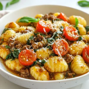 - 1 pound ground beef - 1 package (16 oz) gnocchi - 1 medium onion, finely chopped - 2 cloves garlic, minced - 1 cup heavy cream - 1 cup beef broth - 1 cup fresh or frozen spinach - 1 cup cherry tomatoes, halved - 1 teaspoon Italian seasoning blend - Salt and freshly ground black pepper to taste - 2 tablespoons extra-virgin olive oil - Freshly grated Parmesan cheese for serving - Fresh basil leaves for garnish For this recipe, I use one pound of ground beef. This gives a rich flavor. The gnocchi package should weigh 16 ounces. I like medium onion for balance, finely chopped. Two cloves of garlic give a nice scent. One cup of heavy cream makes the sauce creamy. One cup of beef broth adds depth to the taste. Spinach, fresh or frozen, adds color and nutrition. Cherry tomatoes, one cup, bring sweetness. The Italian seasoning blend gives a classic touch. You can adjust salt and pepper to your taste. I use two tablespoons of extra-virgin olive oil for sautéing. Lastly, freshly grated Parmesan cheese and fresh basil leaves complete the dish. You can swap the ground beef for ground turkey or chicken. This change gives a lighter taste. Consider adding mushrooms for an earthy flavor. Bell peppers can bring a sweet crunch. You might also try adding some red pepper flakes for heat. If you want a vegetarian version, use plant-based ground meat. This keeps the dish hearty while being meat-free. Each option lets you play with flavors while keeping it simple and tasty! {{ingredient_image_2}} Start by boiling a large pot of salted water. When it boils, add the gnocchi. Cook them as the package says. Watch for the gnocchi to float to the top. This means they are ready. Let them cook for 1-2 more minutes. Drain them and set aside for later. In a big skillet, heat the olive oil over medium heat. Add the chopped onion. Sauté for 3-4 minutes until it becomes soft and clear. Then, add the minced garlic. Cook for another minute until you smell its strong aroma. Next, raise the heat to medium-high. Add the ground beef to the skillet. Use a spoon to break it into smaller pieces. Cook for 5-7 minutes until the beef is brown. Don’t forget to season it with salt, pepper, and the Italian seasoning blend. Lower the heat back down to medium. Carefully pour in the beef broth and heavy cream. Stir it all together well. Let it simmer for about 5 minutes. This helps the sauce thicken. Now, fold in the spinach and halved cherry tomatoes. Cook for 3-4 minutes. This will wilt the spinach and soften the tomatoes. The colors will brighten up the dish. Gently add the cooked gnocchi into the creamy sauce. Make sure each gnocchi gets coated well. Let it simmer on low heat for another 2 minutes. This helps the flavors mix together nicely. Once done, take the skillet off the heat. Serve the dish right away. Sprinkle freshly grated Parmesan cheese on top. Add fresh basil leaves for a pop of color. Enjoy it with crusty bread to soak up the creamy sauce. To cook gnocchi well, start with a large pot of salted water. The salt helps flavor the gnocchi. Bring the water to a rolling boil before adding the gnocchi. Watch them closely. Once they float, cook for 1-2 more minutes. This ensures they are tender. Drain them well to avoid sogginess. For a tasty dish, don't skip the seasonings. Use salt and black pepper to taste. Italian seasoning adds depth. You can also try a pinch of red pepper flakes for heat. Fresh herbs like basil enhance the dish's aroma and taste. Always taste as you go to adjust flavors. Avoid overcooking the gnocchi. It can make them mushy. Also, don’t rush the browning of the beef. Take your time to develop flavor. If you add spinach too early, it can lose its vibrant color and crunch. Lastly, always mix gently when combining gnocchi with the sauce to keep them intact. Pro Tips Fresh Ingredients Matter: Always use fresh spinach and ripe cherry tomatoes for the best flavor and vibrant color in your dish. Perfectly Cooked Gnocchi: Make sure to cook the gnocchi until they float to the surface, as this indicates they are cooked properly and will hold their shape in the sauce. Customize Your Seasoning: Don't hesitate to adjust the seasoning according to your taste; add more Italian seasoning or a pinch of red pepper flakes for a spicy kick! Make Ahead for Easy Meals: This dish can be made ahead of time and reheated. Just add a splash of beef broth or cream when warming to keep it creamy. {{image_4}} You can easily swap ground beef for other proteins. Ground turkey or chicken works well. They both offer a lighter flavor. For a richer taste, try using ground lamb. You can also use diced pork for a twist. Make sure to adjust cooking times as needed. Each protein brings its own unique flavor to the dish. If you want a vegetarian version, skip the meat. Use mushrooms as the main ingredient. They add great texture and flavor. You can also use lentils for protein. Cook them in the same way as you would the meat. Adding extra herbs can enhance the flavor. Try fresh thyme or rosemary for depth. Feel free to add your favorite vegetables to the mix. Zucchini or bell peppers work great. You can also toss in some peas or carrots. Just chop them small so they cook evenly. Adding veggies boosts the nutrition and flavor. Mix and match based on what you have at home. This dish is all about creativity! To keep your creamy ground beef gnocchi fresh, first let it cool. Once cool, place it in an airtight container. Store it in the fridge. It will stay fresh for about 3-4 days. Make sure to label the container with the date. This helps you remember when you made it. When you’re ready to enjoy leftovers, reheat them on the stove. Place the gnocchi in a skillet over low heat. Stir it often to warm it evenly. If it seems dry, add a splash of beef broth or cream. You can also use the microwave. Heat it in a microwave-safe dish for 1-2 minutes. Stir halfway through to ensure it heats well. If you want to save some for later, freezing works great. First, cool the dish completely. Then, transfer it to a freezer-safe container. It can last up to 3 months in the freezer. When you’re ready to eat, thaw it overnight in the fridge. Reheat as mentioned before. Enjoy your creamy ground beef gnocchi anytime! To make the sauce thicker, you can simmer it longer. This helps reduce the liquid. You can also add a little cornstarch mixed with water. Just stir it in slowly until the sauce thickens to your liking. Yes, you can use homemade gnocchi! Fresh gnocchi often tastes great and adds a personal touch. Just be sure to cook it until it floats, just like the store-bought type. You can serve this dish with a side salad or garlic bread. A light arugula salad adds freshness. Garlic bread is perfect for soaking up the creamy sauce. It takes about 15 minutes to prep and 15 minutes to cook. So, you can have this meal ready in just 30 minutes! Yes, you can make it dairy-free! Use coconut cream instead of heavy cream. Also, swap out cheese for a dairy-free option. This way, you can enjoy the same creamy goodness without dairy. In this post, we explored the key ingredients and easy steps for making creamy ground beef gnocchi. I shared tips for cooking the gnocchi, sautéing, and creating the sauce. We also discussed various options to customize the dish and how to store any leftovers. Remember, cooking is about experimenting. Use what you like and have on hand. Enjoy your time in the kitchen and make this dish your own!