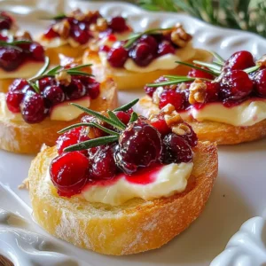 - 1 French baguette, cut into 1/2-inch thick rounds - 8 ounces Brie cheese, sliced into thin pieces - 1 cup fresh cranberries - 1/4 cup granulated sugar - 1/4 cup water - 1 teaspoon fresh rosemary, finely chopped - 1 tablespoon honey - 2 tablespoons walnuts, chopped (optional) - Salt and freshly ground black pepper, to taste The French baguette is the base for this dish. It should be fresh and crusty. Choose one that is slightly chewy inside. The Brie cheese must be creamy and soft. Look for high-quality Brie for rich flavor. Fresh cranberries are the star of this recipe. You can find them in the produce section during fall and winter. For sweetness, we use granulated sugar and honey. These balance the tartness of the cranberries. You can add fresh rosemary for a lovely herbal note. If you want crunch, walnuts are an excellent choice. They add texture and a nutty flavor. Each ingredient plays a key role in making this appetizer a hit. You&rsquo;ll love how they work together! {{ingredient_image_2}} 1. Preheating the oven: Start by preheating your oven to 375&deg;F (190&deg;C). This step is key for crisp crostini. 2. Preparing the baguette slices: Cut a French baguette into 1/2-inch thick rounds. Lay them out on a lined baking sheet without overlapping. 3. Baking the crostini: Brush each baguette slice with olive oil. Sprinkle a pinch of salt on top. Bake for 8-10 minutes until they are golden brown and crisp. 1. Cooking the cranberries: In a medium saucepan, mix 1 cup of fresh cranberries, 1/4 cup sugar, 1/4 cup water, and a pinch of salt. Cook over medium heat. Stir often until the cranberries burst, about 10 minutes. 2. Adding rosemary and honey: Once the cranberries are soft, stir in 1 teaspoon of finely chopped rosemary and 1 tablespoon of honey. Remove it from heat. Let it cool, as it will thicken more. 1. Topping the crostini with Brie: After baking, take out the crostini. Place a slice of Brie cheese on each toasted round. 2. Spoon cranberry sauce and optional nuts: Generously spoon the cranberry mixture over the cheese. Add chopped walnuts on top if you want a crunchy texture. 3. Final baking for cheese melting: Return the crostini to the oven. Bake for another 5 minutes to warm the cheese and let it melt slightly. Enjoy your flavorful Cranberry Brie Crostini while warm! To make the perfect crostini, start with a fresh baguette. Cut it into 1/2-inch thick rounds. This thickness helps create a crisp bite. Brush each slice with olive oil for flavor and crunch. Here are some tips to prevent sogginess in your crostini: - Bake the baguette slices until golden brown. This adds a nice crunch. - Keep them in a single layer while baking. This helps them crisp evenly. - Avoid spreading too much sauce on top before baking. A little goes a long way! For hosting, pair these crostini with a light white wine or sparkling drink. They also go well with a fresh salad or charcuterie board. When it comes to presentation, place the crostini on a nice platter. You can add a sprig of rosemary on each piece. This adds color and a hint of freshness. Drizzling honey over the top can also make them look fancy! Pro Tips Choose the Right Brie: Opt for a high-quality Brie cheese for a creamy and flavorful experience. Look for one with a good balance of softness and flavor. Add a Zesty Twist: For an extra zing, consider adding a splash of balsamic vinegar to the cranberry mixture while it cooks. This will enhance the flavors and provide a delightful contrast. Customize Your Toppings: Feel free to experiment with toppings! Try adding pomegranate seeds, sliced figs, or even a sprinkle of blue cheese for a unique flavor profile. Serve with a Side: Pair these crostini with a light salad or a charcuterie board for a well-rounded appetizer spread that guests will love. {{image_4}} You can switch up the cheese if you want. Goat cheese or cream cheese works well. They add unique flavors that mix nicely with cranberries. For fruit, try apples or pears in season. They bring a fresh touch while keeping it sweet. Spices can change things up. Consider adding a pinch of cinnamon or nutmeg to the cranberry sauce. They add warmth and depth. Fresh herbs like thyme or tarragon can also brighten the flavor. Just chop them finely and mix in. For gluten-free options, use gluten-free baguette or crackers. This way, everyone can enjoy the dish. If you want a vegan version, swap the Brie for a nut-based cheese. You can also replace honey with maple syrup or agave nectar. These changes keep the recipe delicious and friendly for all diets. To keep your crostini fresh, store them in an airtight container. Place parchment paper between layers to avoid sogginess. Aim to consume them within two days for the best taste. If you notice any moisture, you can lightly re-toast them in the oven for a few minutes. This helps restore their crispiness. You can freeze the assembled crostini, but the texture may change once thawed. Wrap each crostini in plastic wrap and then put them in a freezer bag. Make sure to squeeze out as much air as possible. When you are ready to eat, thaw them in the fridge overnight. For reheating, place the crostini on a baking sheet. Heat them in a 350&deg;F (175&deg;C) oven for about 10 minutes. This will warm the cheese and crisp up the bread again. Enjoy them warm for the best flavor! Can I make the cranberry sauce ahead of time? Yes, you can make the cranberry sauce a day in advance. Store it in an airtight container in the fridge. This saves time and lets the flavors deepen. How long do crostini stay fresh? Crostini stay fresh for about 1-2 days if stored in a cool, dry place. Keep them in an airtight container to maintain their crunch. What is the best way to reheat crostini? To reheat crostini, place them in a preheated oven at 350&deg;F (175&deg;C) for about 5-7 minutes. This keeps them crispy and warm without making them soggy. Can I use dried cranberries instead? Yes, dried cranberries can work in a pinch. However, you may need to soak them in warm water to soften them. Adjust the sugar based on their sweetness. How do I make this dish spicier? To add heat, sprinkle red pepper flakes or cayenne pepper in the cranberry sauce. You can also add sliced jalape&ntilde;os on top of the crostini for extra kick. This guide showed you how to create a delicious crostini with Brie and cranberry. We covered the ingredients, step-by-step instructions, and even tips for the best results. You can impress your guests with this simple yet tasty dish. Remember, feel free to explore variations and substitutions to match your taste. Enjoy making this crostini, and savor the wonderful flavors!